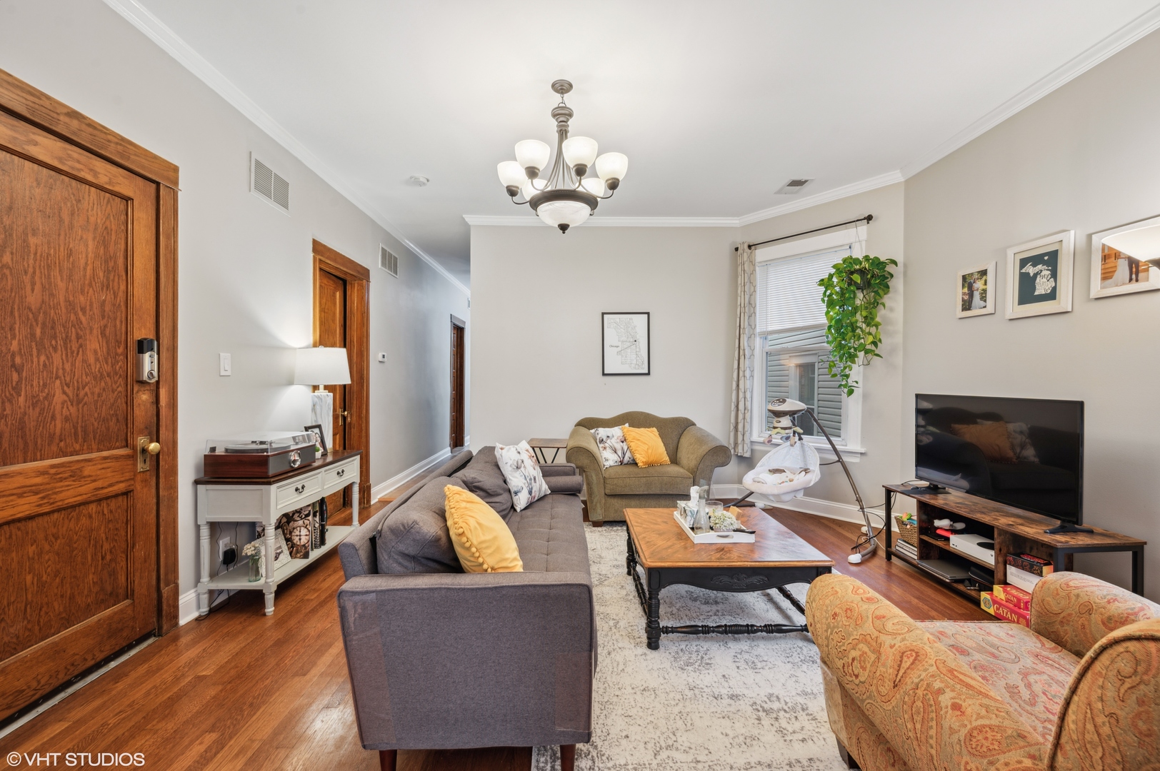 2441 North Avers Avenue Chicago, IL 60647 - Photo 17 of 28 a living room with furniture a flat screen tv and a window