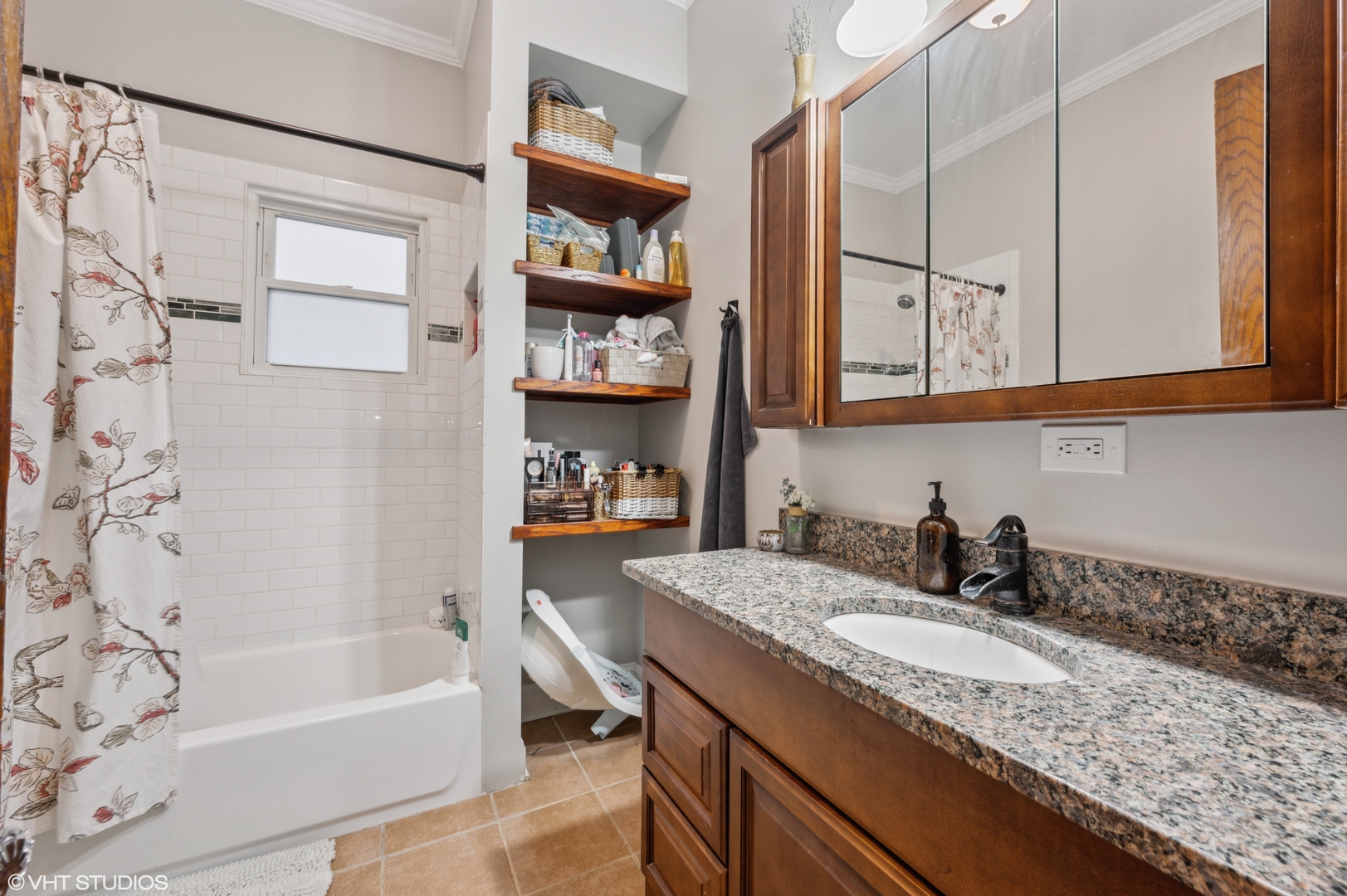 2441 North Avers Avenue Chicago, IL 60647 - Photo 23 of 28 a bathroom with a granite countertop sink a mirror and a bathtub