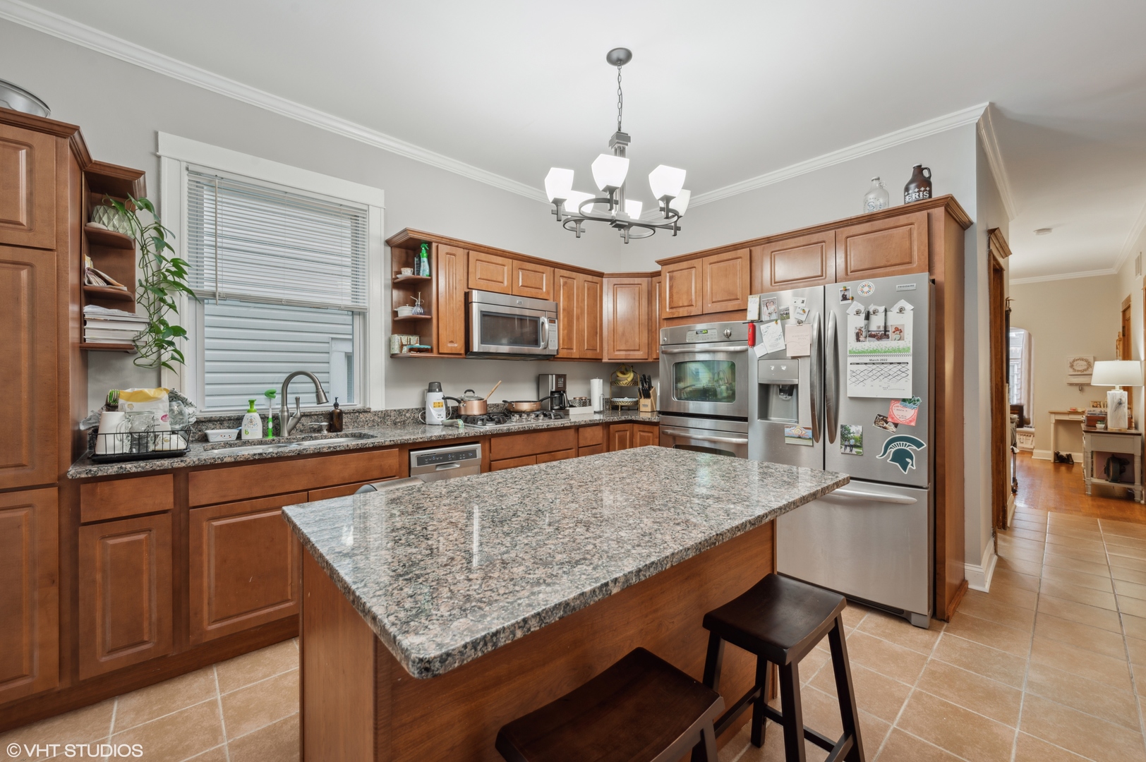 2441 North Avers Avenue Chicago, IL 60647 - Photo 25 of 28 a kitchen with stainless steel appliances granite countertop counter space a sink and refrigerator