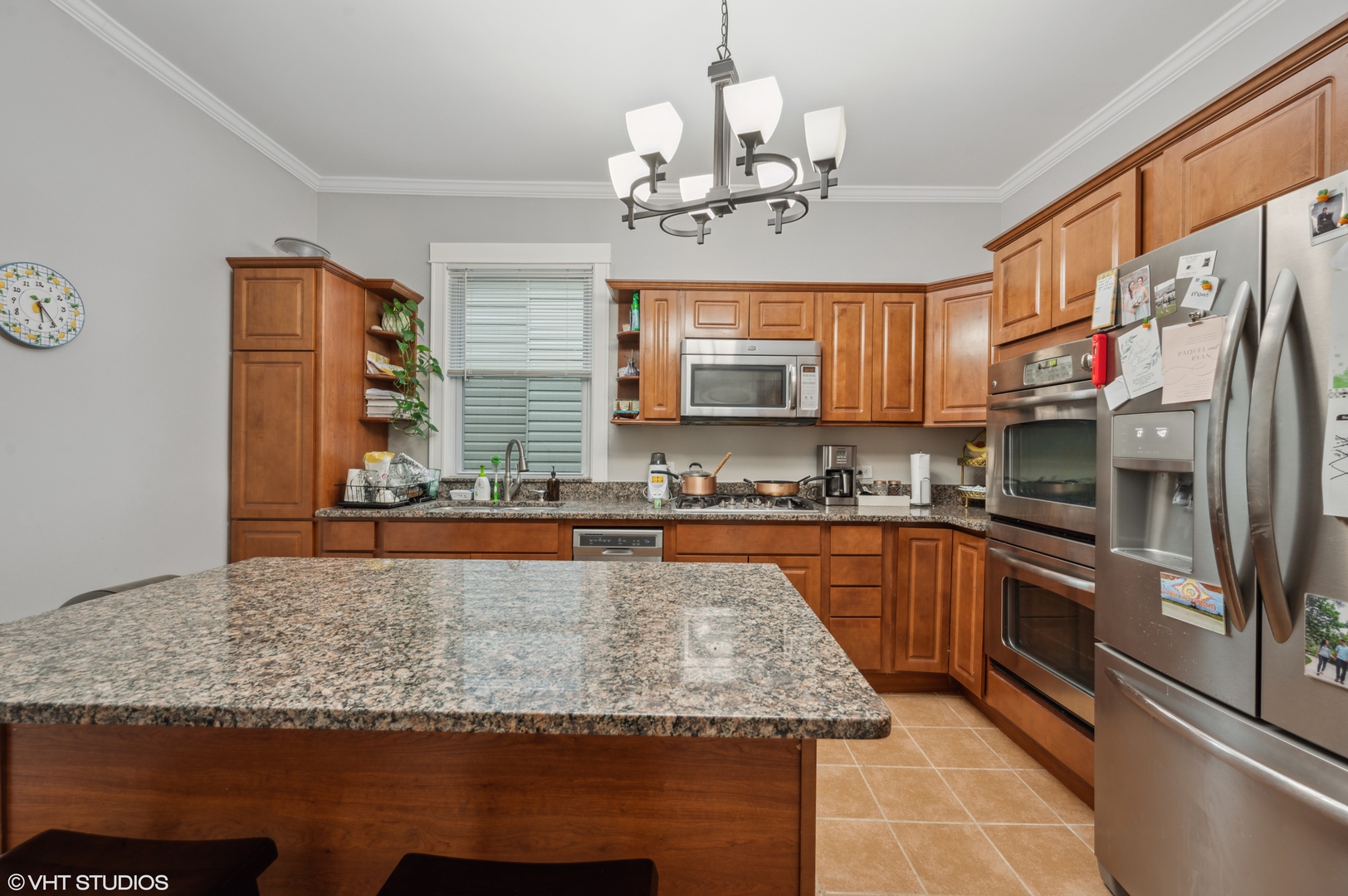 2441 North Avers Avenue Chicago, IL 60647 - Photo 26 of 28 a large kitchen with granite countertop a sink and dishwasher a stove top oven with wooden floor