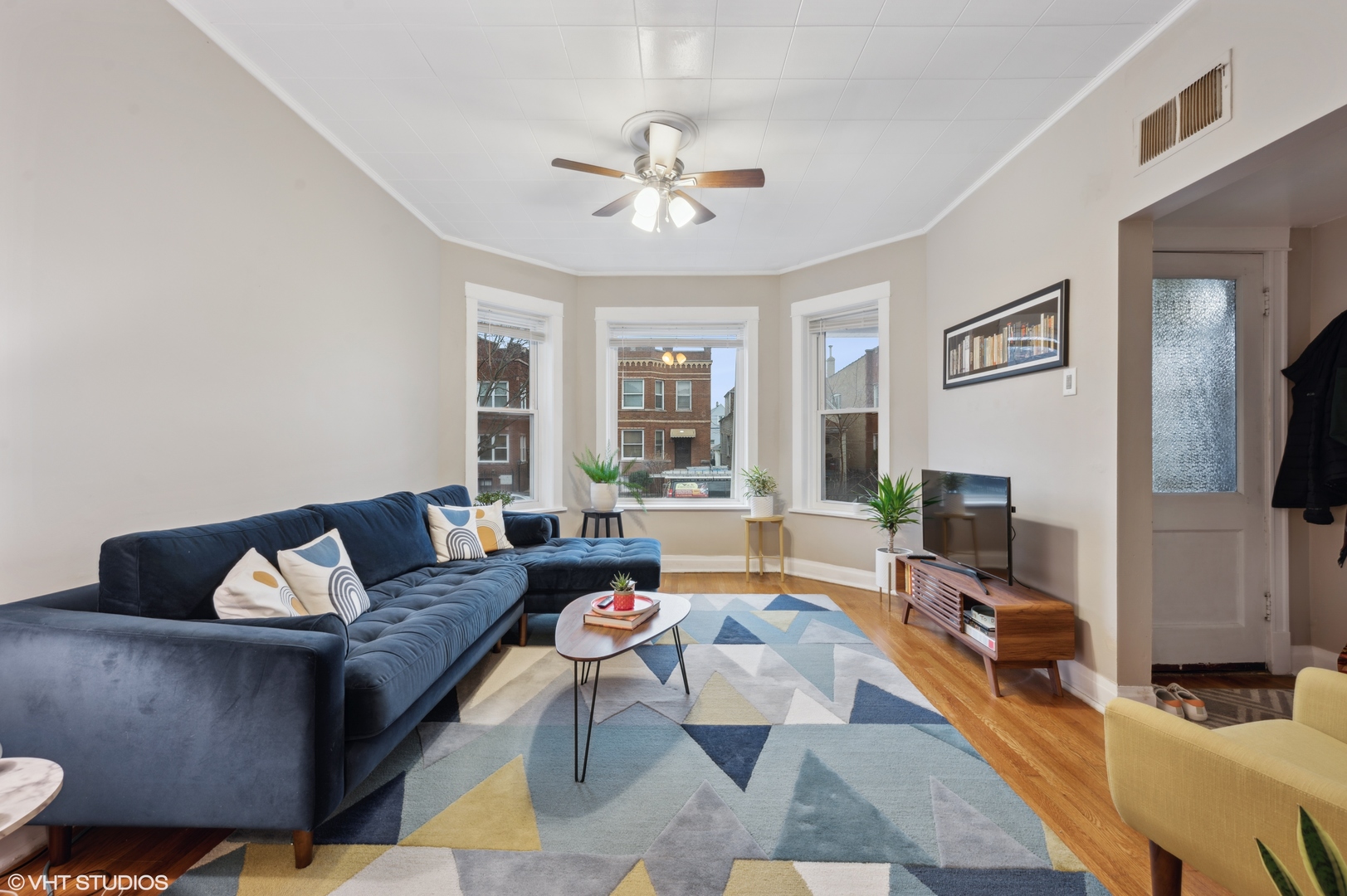 2441 North Avers Avenue Chicago, IL 60647 - Photo 3 of 28 a living room with furniture and a fireplace