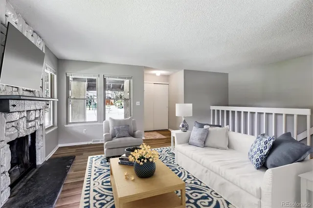 a bed room with furniture and a fireplace