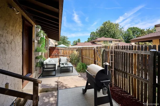 a front view of a house with a garden and yard