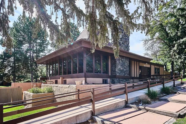 a view of a backyard with sitting area
