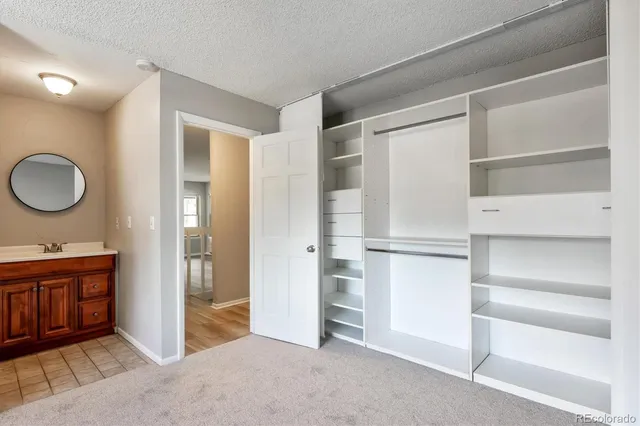 a kitchen with a refrigerator and sink