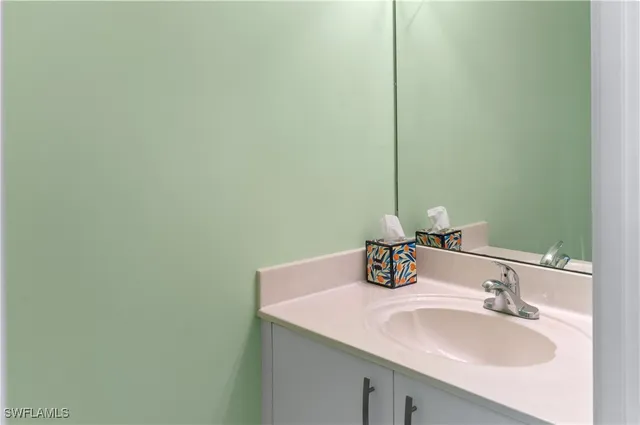 a bathroom with a sink and a mirror