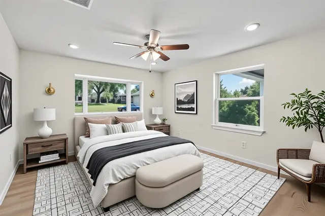 a bedroom with a large bed and a window