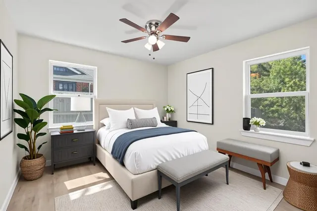 a bed room with a bed and a window