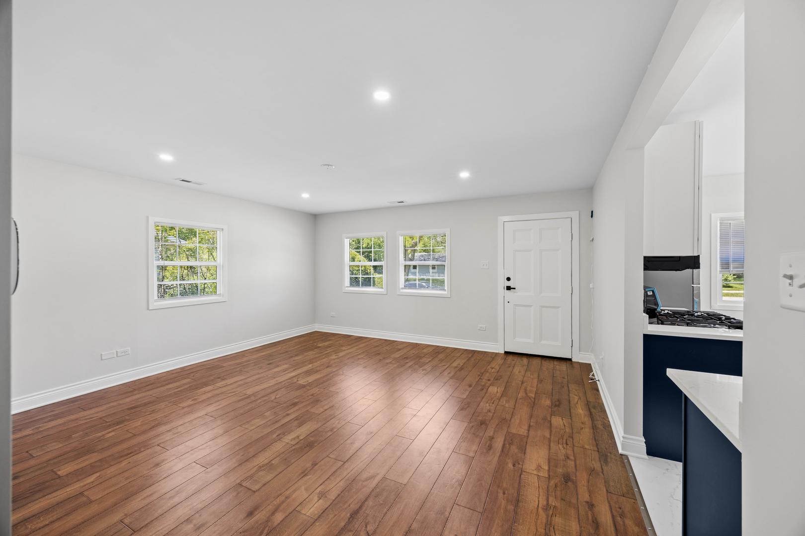 570 Andover Street Chicago Heights, IL 60411 - Photo 7 of 22 wooden floor in an empty room with a window
