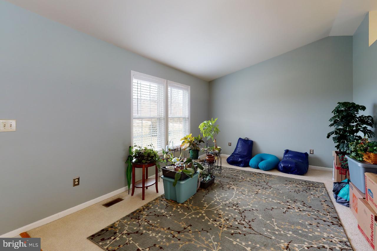 5850 Ketch Road Prince Frederick, MD 20678 - Photo 22 of 35 Living room with vaulted ceiliings