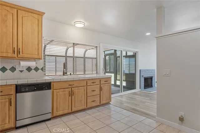 a large kitchen with a sink and cabinets