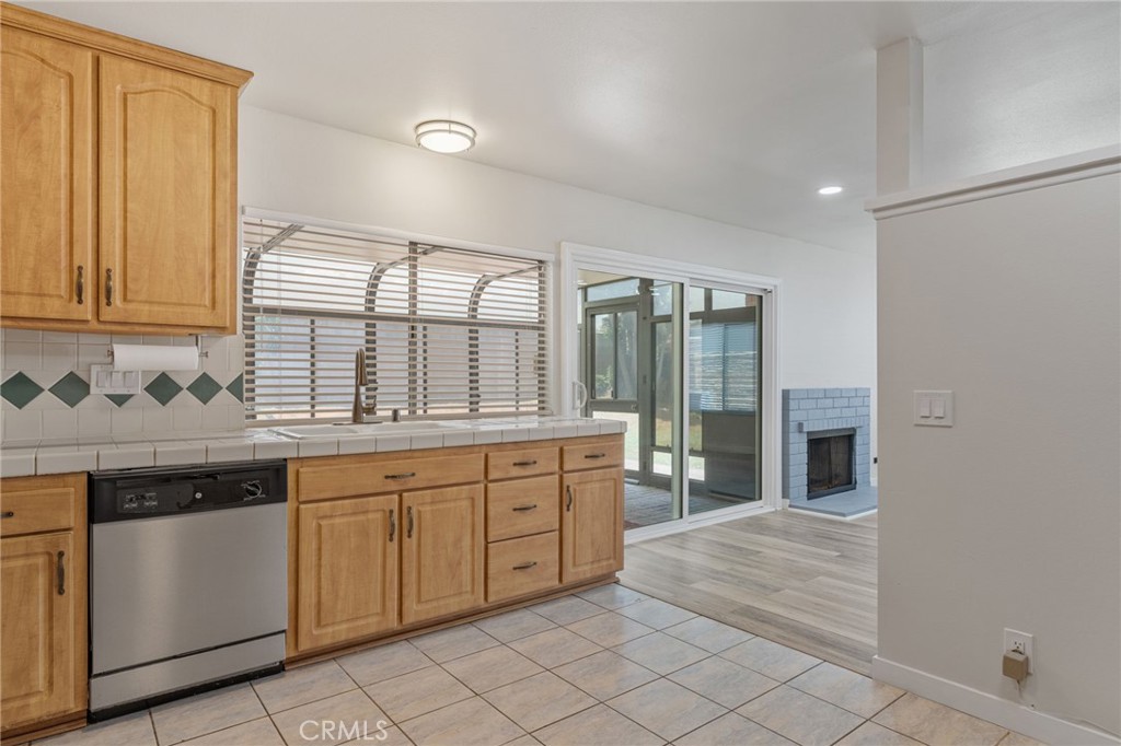 1708 East Cyrene Drive Carson, CA 90746 - Photo 12 of 26 a large kitchen with a sink and cabinets