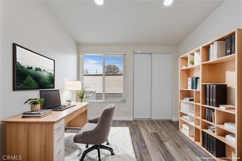 1708 East Cyrene Drive Carson, CA 90746 - Photo 18 of 26 a view of a workspace with furniture and a window