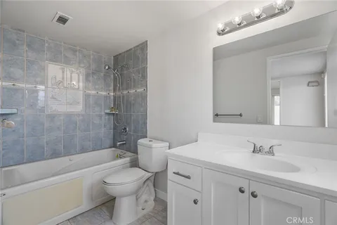 a bathroom with a sink a toilet and a bathtub