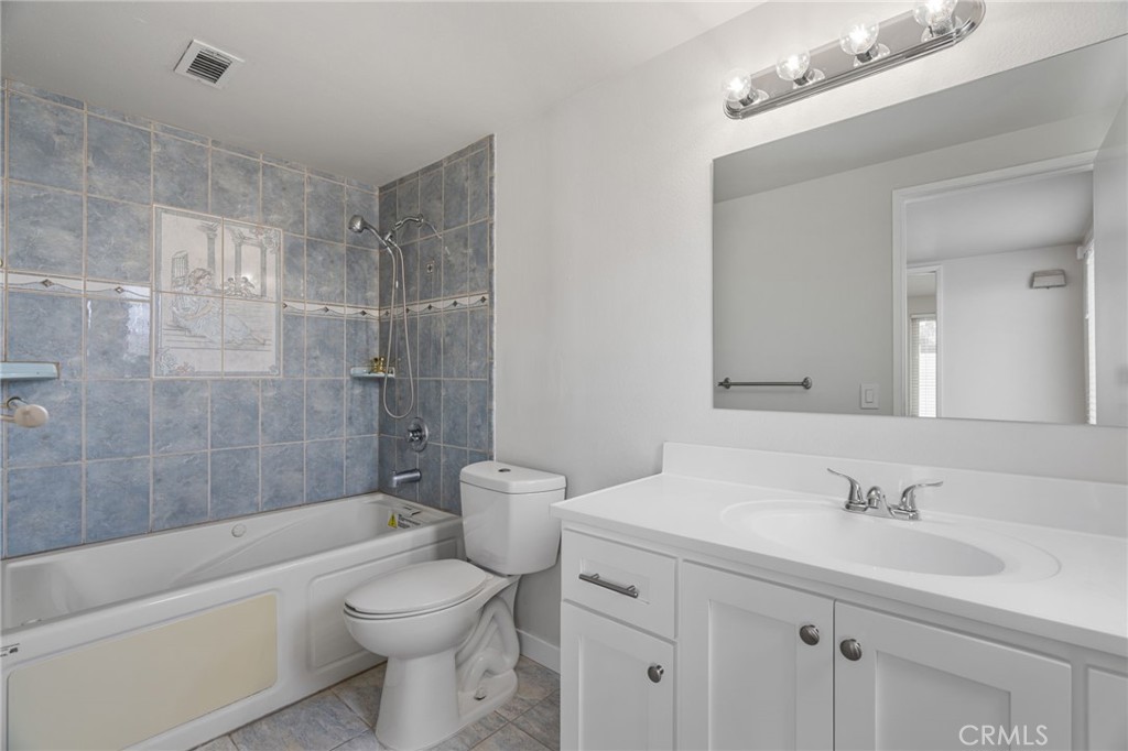 1708 East Cyrene Drive Carson, CA 90746 - Photo 19 of 26 a bathroom with a sink a toilet and a bathtub