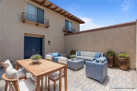 a view of a patio with couches table and chairs