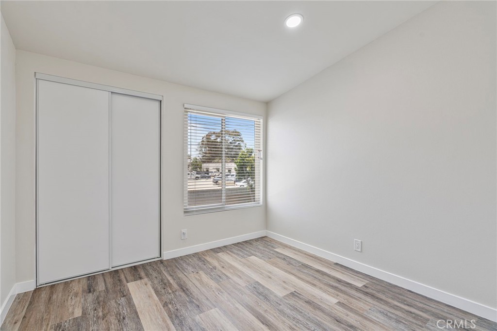 1708 East Cyrene Drive Carson, CA 90746 - Photo 21 of 26 wooden floor in an empty room with a window