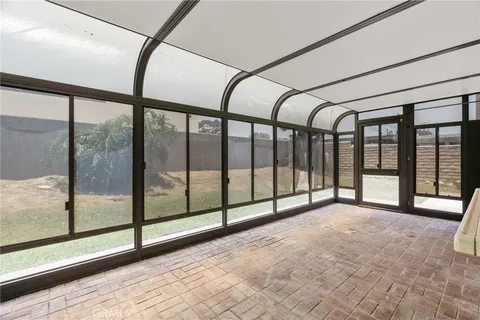 a view of an empty room with a large window