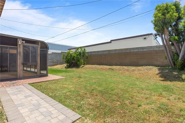 a view of backyard with tub and trees