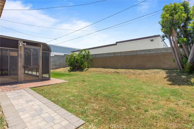 a view of backyard with tub and trees