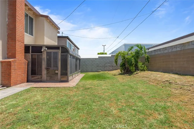 a view of a backyard of the house