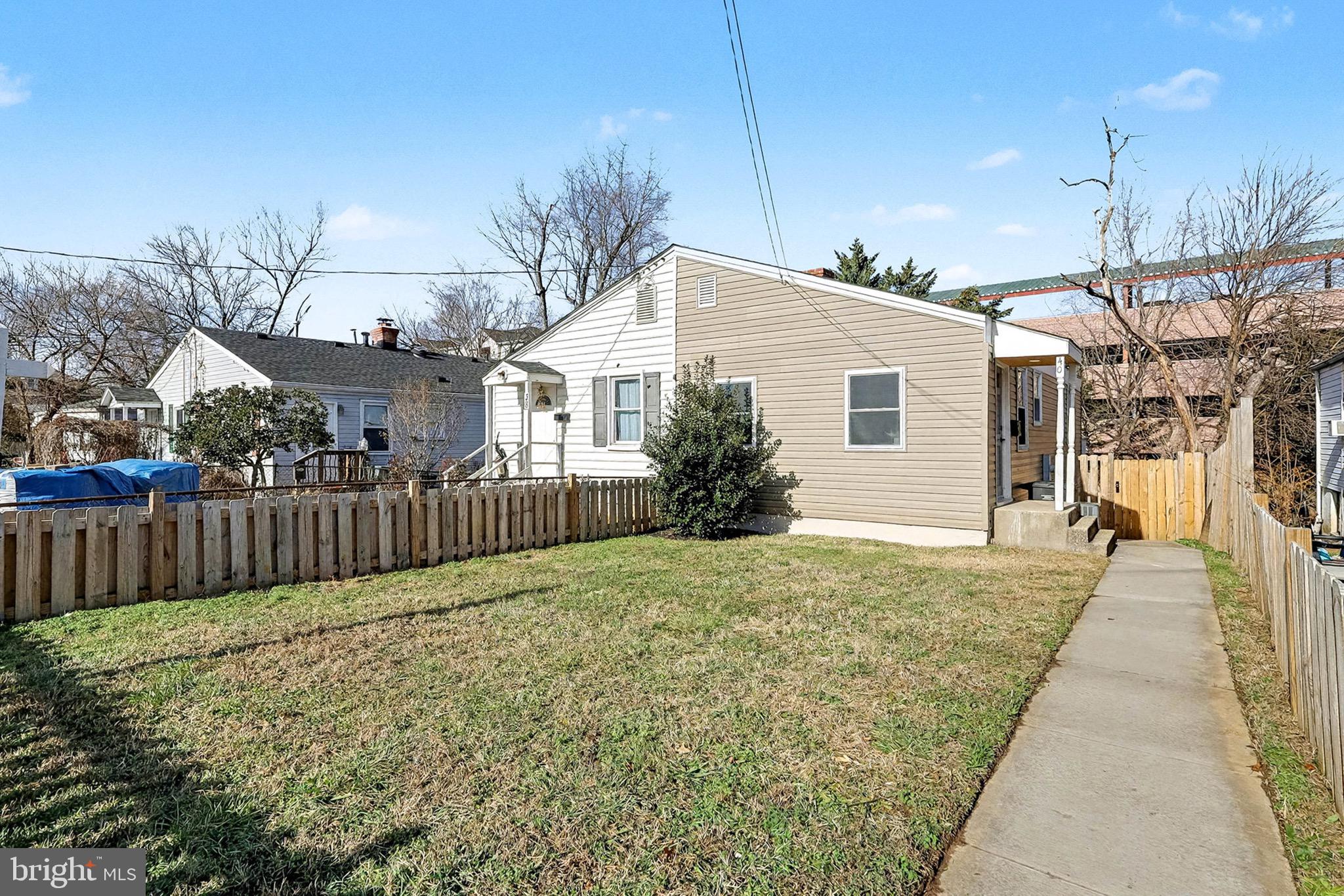 40 East Reed Avenue Alexandria, VA 22305 - Photo 1 of 19 a front view of a house with a yard