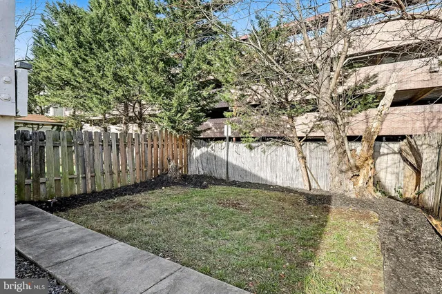 a view of a backyard of the house