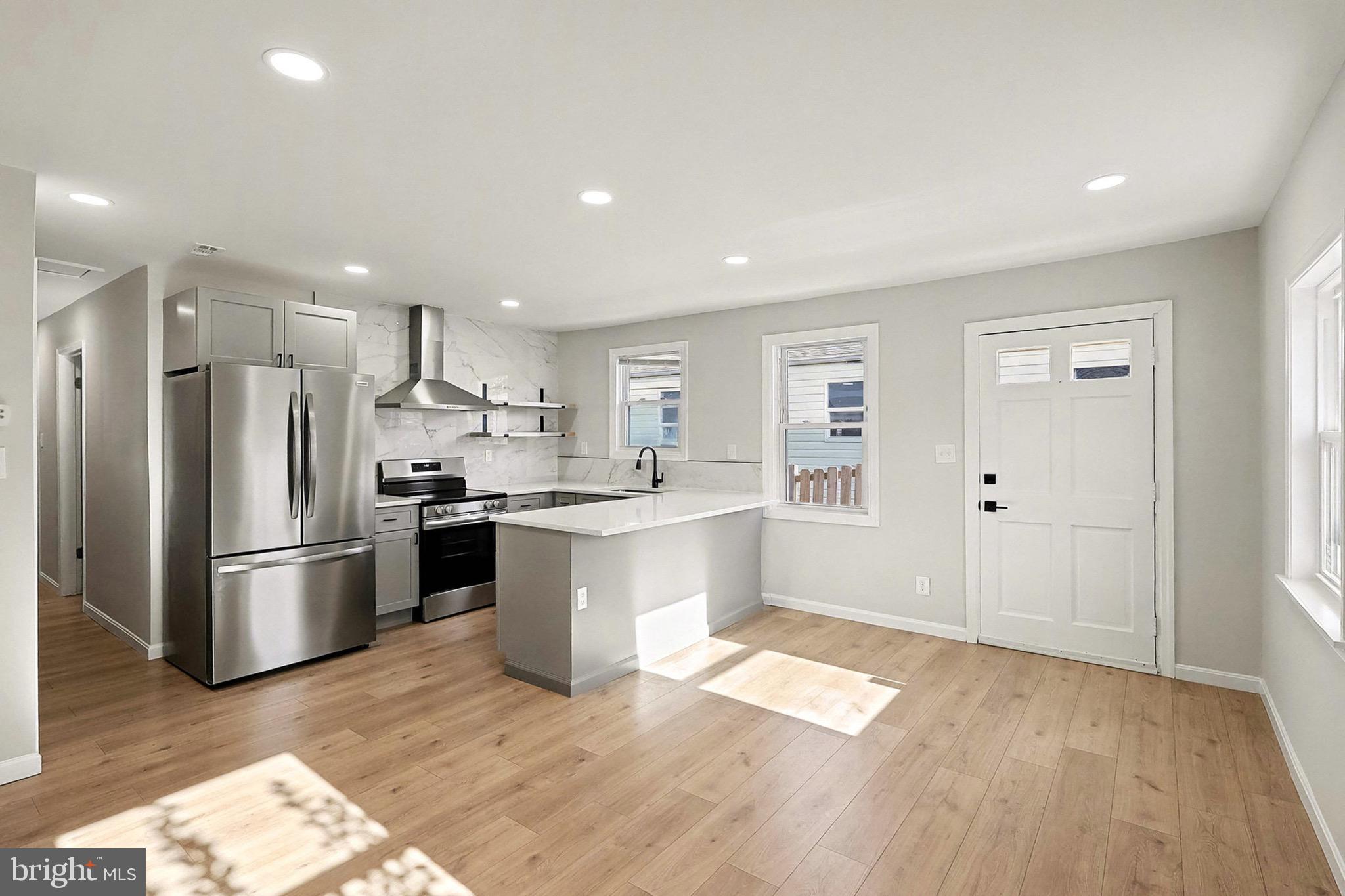 40 East Reed Avenue Alexandria, VA 22305 - Photo 2 of 19 a large kitchen with a lot of counter space and stainless steel appliances