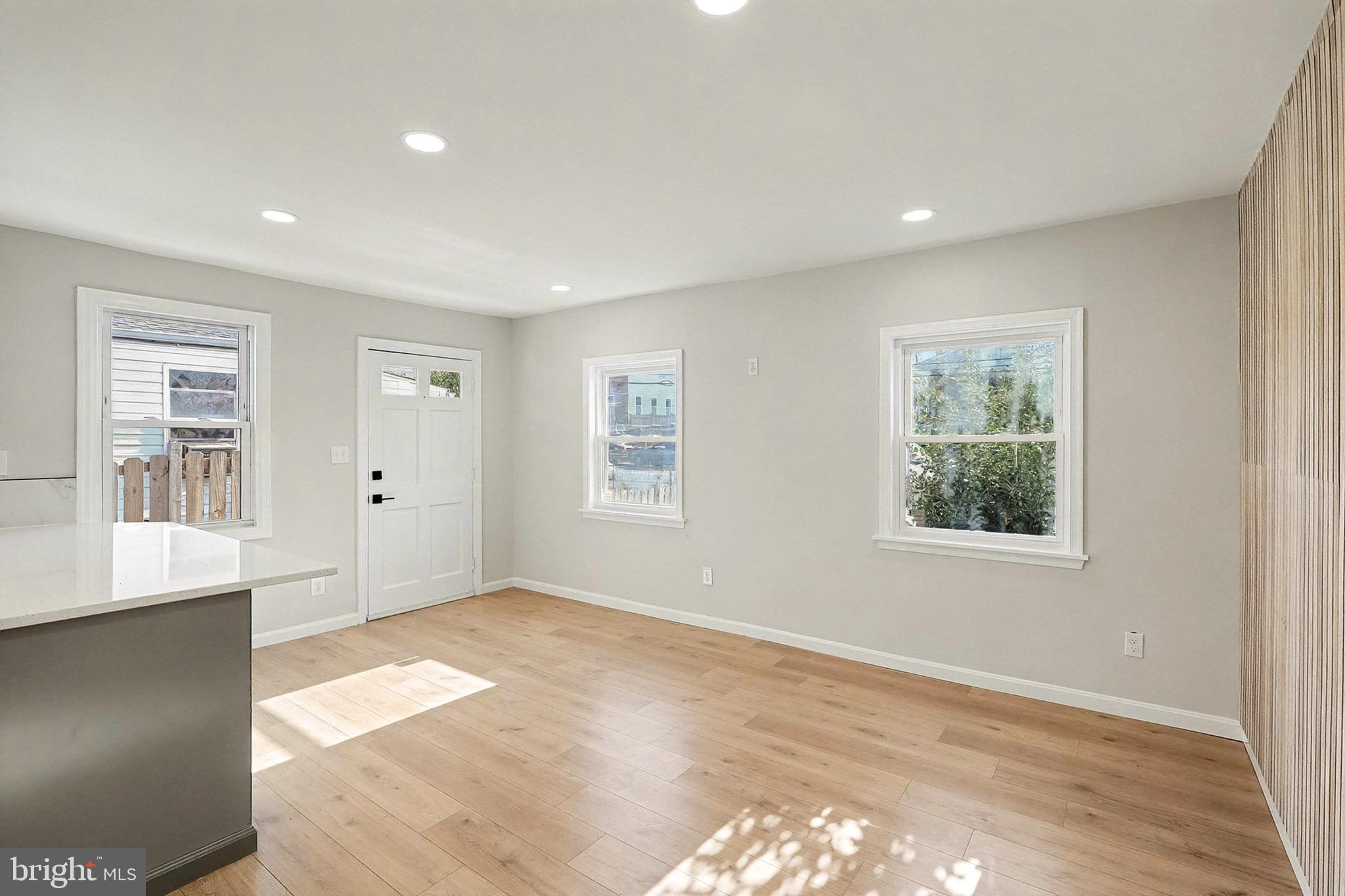 40 East Reed Avenue Alexandria, VA 22305 - Photo 3 of 19 wooden floor in an empty room with a window
