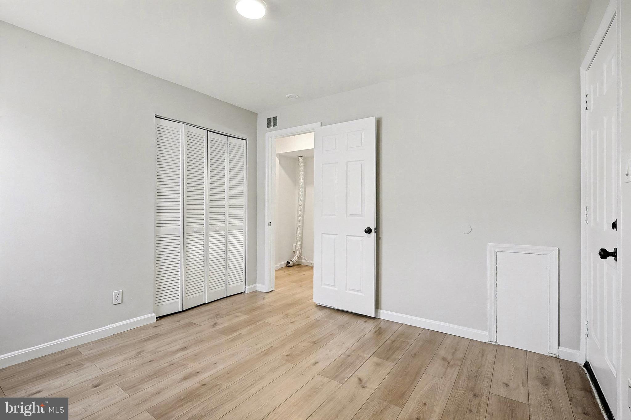 40 East Reed Avenue Alexandria, VA 22305 - Photo 8 of 19 a view of an empty room with wooden floor
