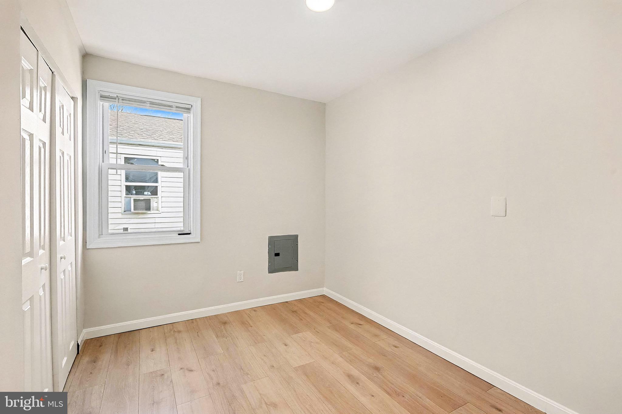 40 East Reed Avenue Alexandria, VA 22305 - Photo 9 of 19 a view of an empty room with wooden floor and a window
