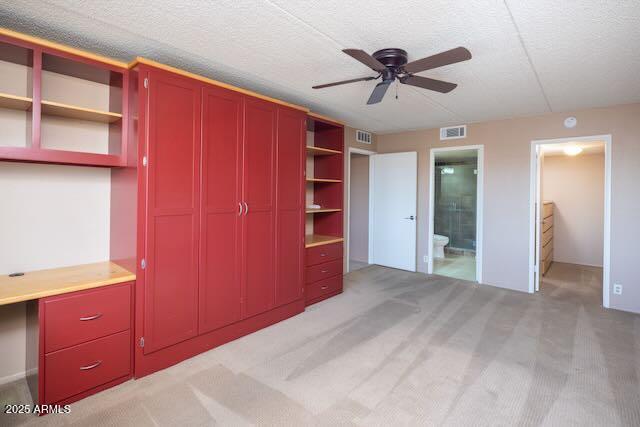 7830 East Camelback Road, Unit 708 Scottsdale, AZ 85251 - Photo 11 of 21 a view of an empty room with a cabinet and a ceiling fan