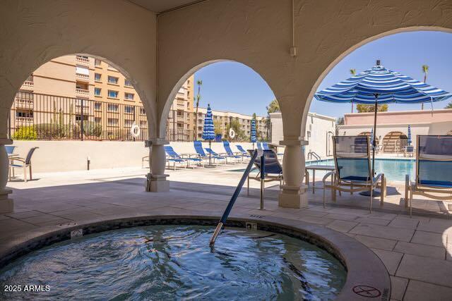 7830 East Camelback Road, Unit 708 Scottsdale, AZ 85251 - Photo 19 of 21 a view of swimming pool with outdoor seating