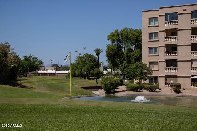 7830 East Camelback Road, Unit 708 Scottsdale, AZ 85251 - Photo 20 of 21 a view of a fountain in front of a building