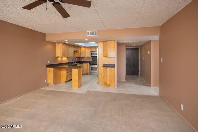 7830 East Camelback Road, Unit 708 Scottsdale, AZ 85251 - Photo 4 of 21 a view of a kitchen with a sink and a refrigerator