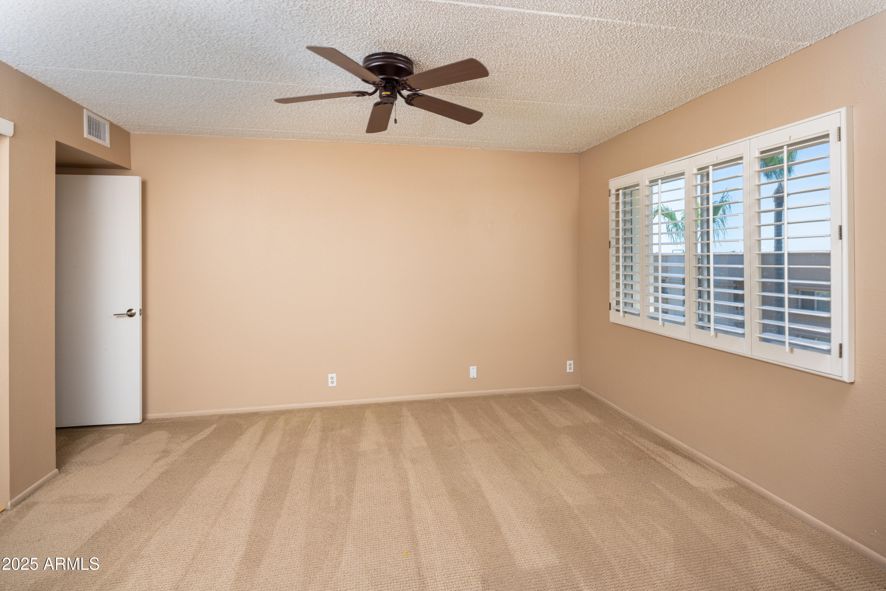7830 East Camelback Road, Unit 708 Scottsdale, AZ 85251 - Photo 8 of 21 a view of an empty room with a window