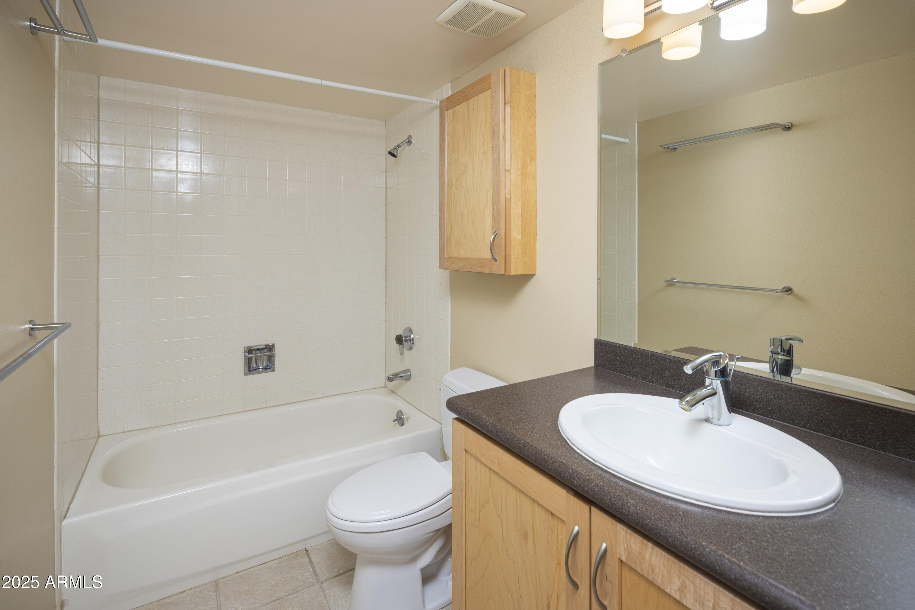 7830 East Camelback Road, Unit 708 Scottsdale, AZ 85251 - Photo 9 of 21 a bathroom with a sink a toilet and a bathtub