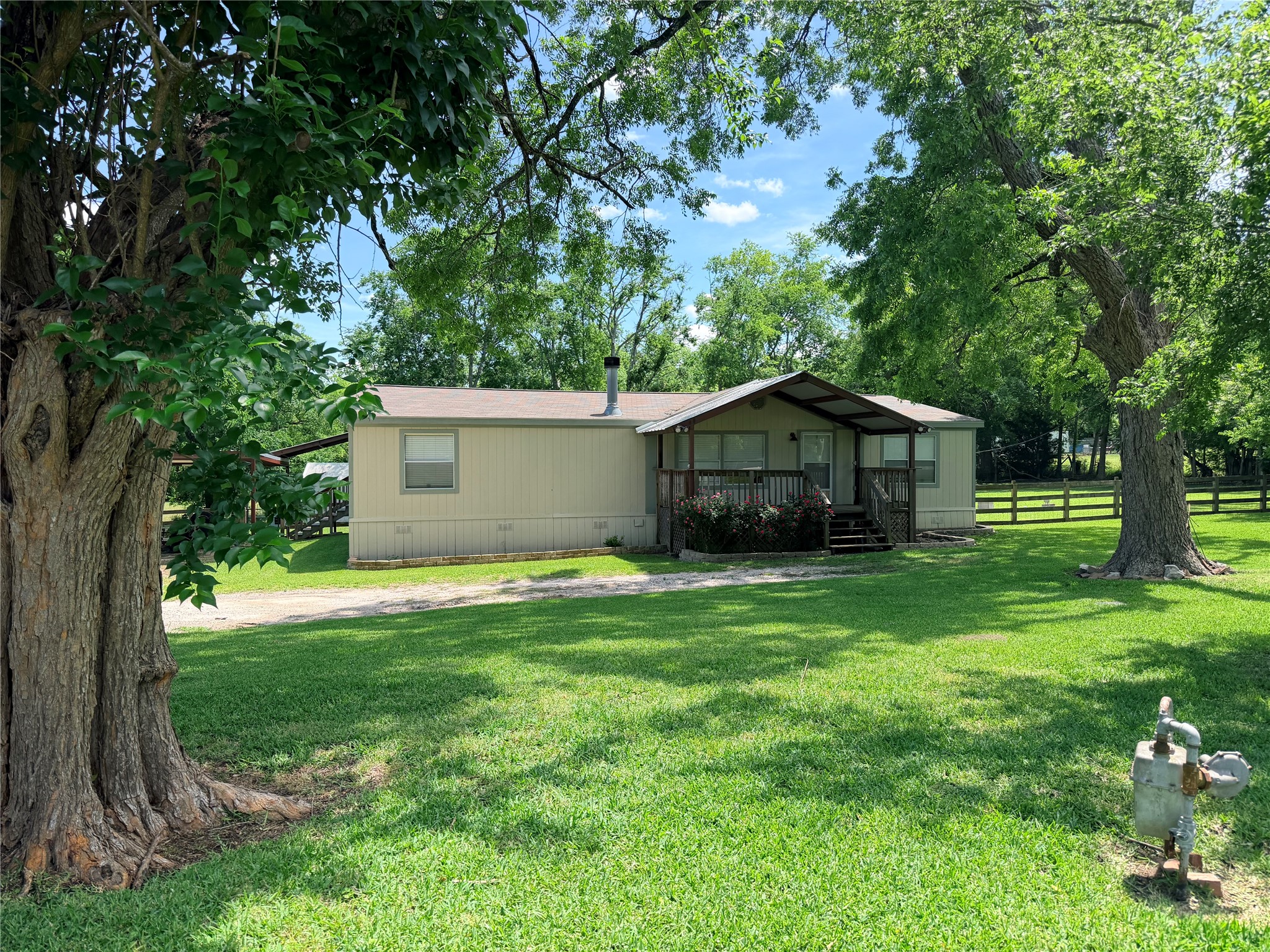 263 Camden Road Chester, TX 75936 - Photo 1 of 49 a house view with a garden space