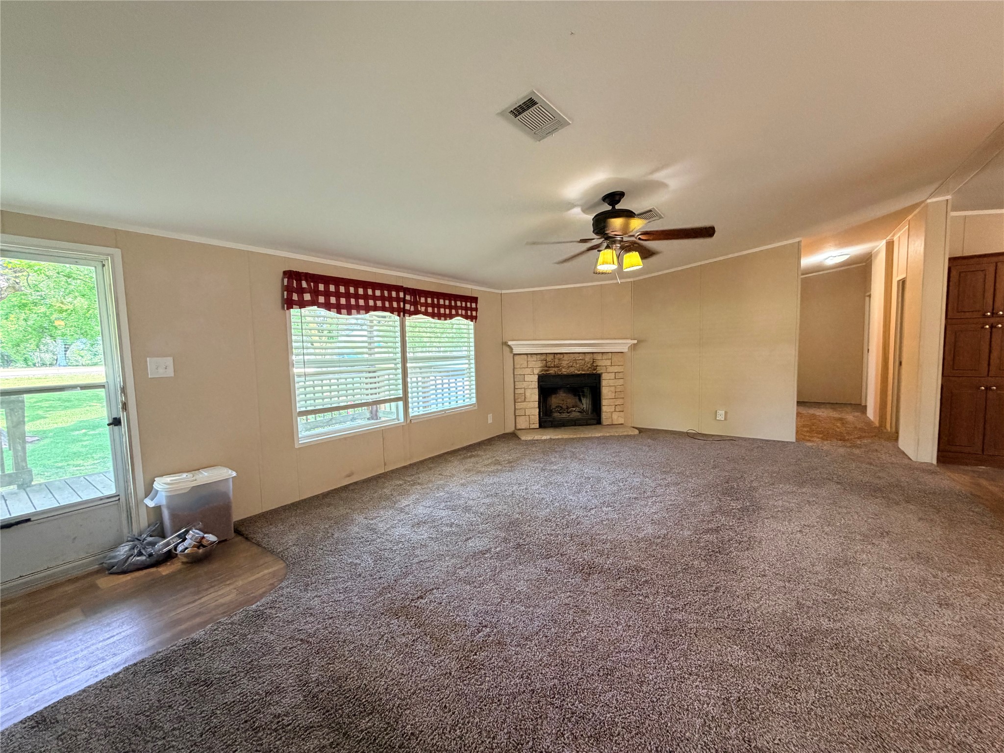 263 Camden Road Chester, TX 75936 - Photo 11 of 49 a view of empty room with a fireplace and window