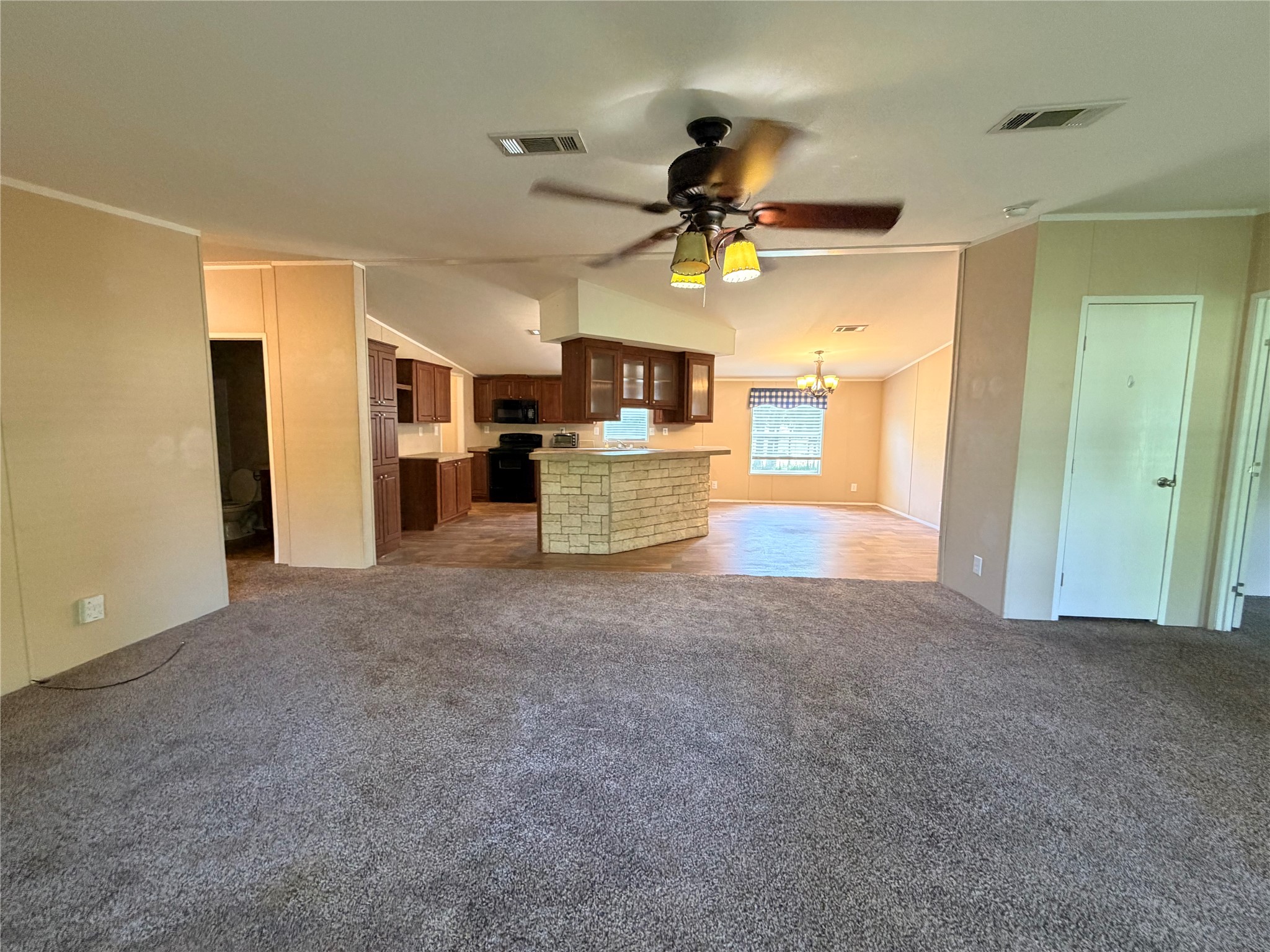 263 Camden Road Chester, TX 75936 - Photo 27 of 49 a view of a kitchen and a fireplace in a room