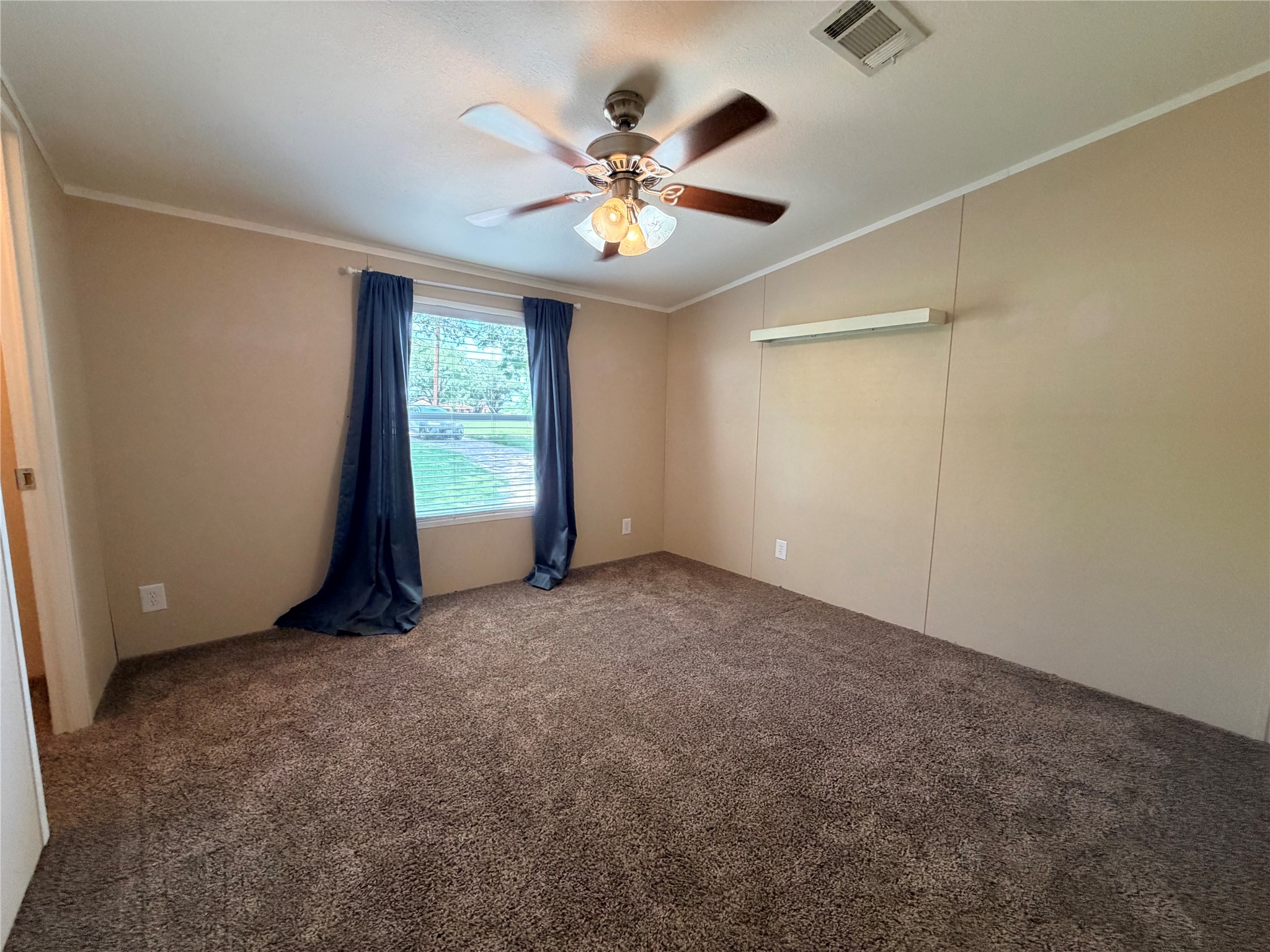 263 Camden Road Chester, TX 75936 - Photo 34 of 49 an empty room with windows and fan