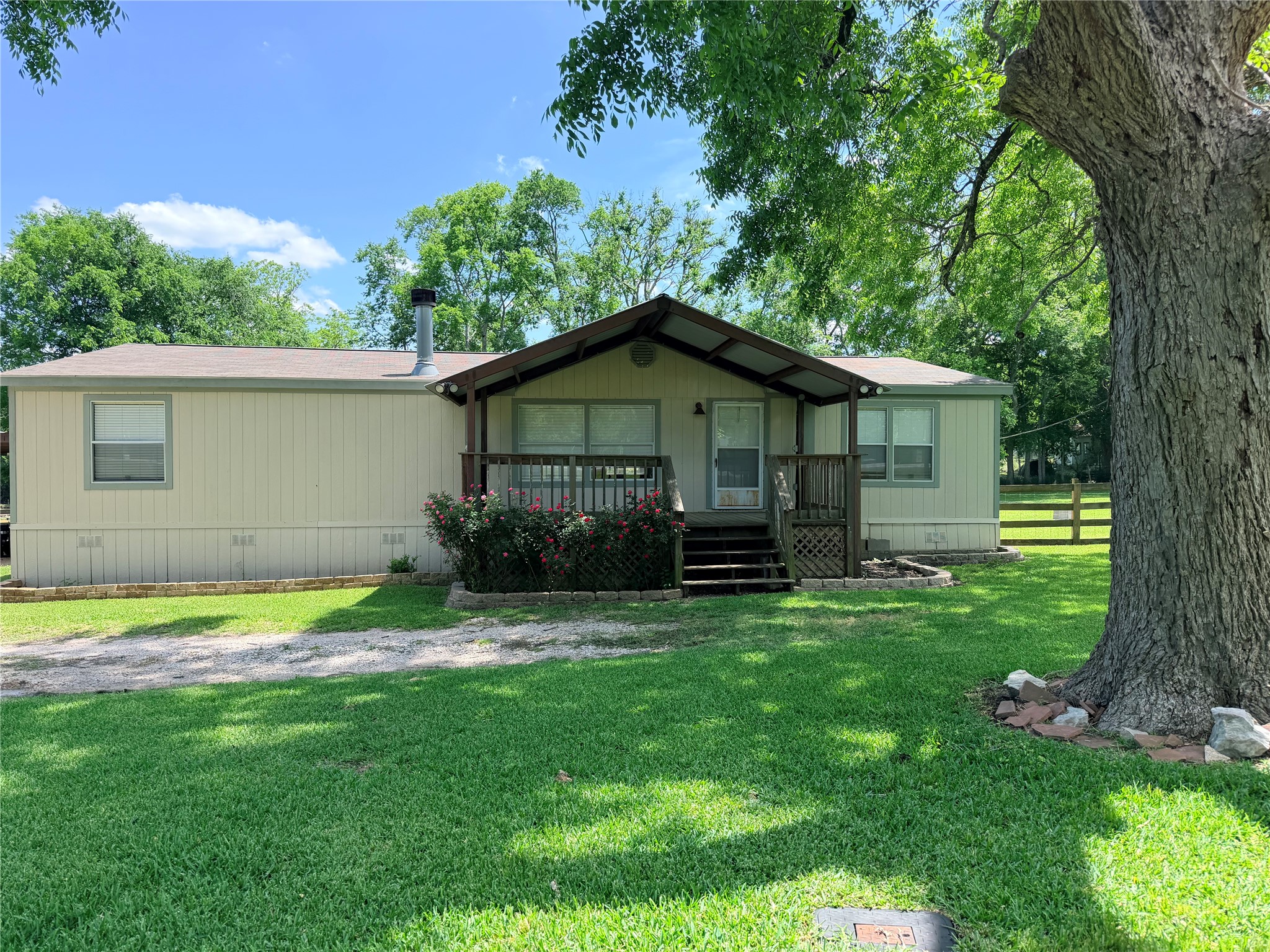 263 Camden Road Chester, TX 75936 - Photo 5 of 49 a front view of a house with a garden