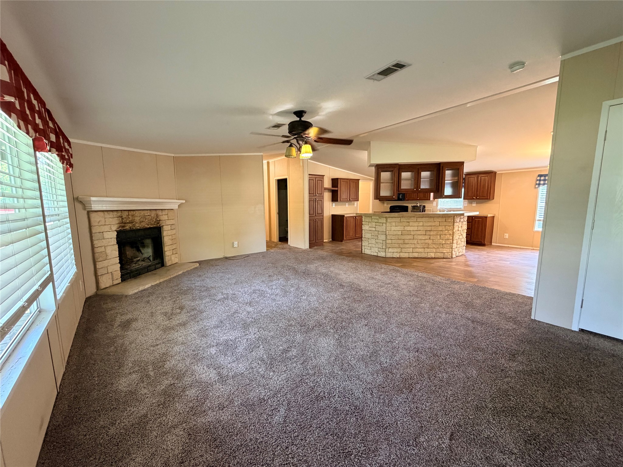 263 Camden Road Chester, TX 75936 - Photo 9 of 49 a view of a kitchen with a sink and a fireplace