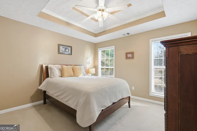 a bedroom with a bed and window