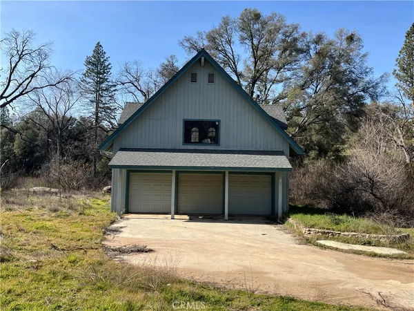a house with trees in the background