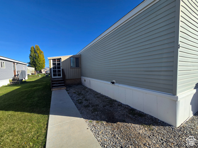 8 West Sunset North Preston, ID 83263 - Photo 1 of 1 View of side of home featuring a lawn and entry steps