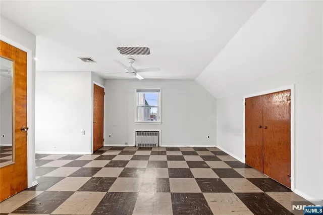 a view of a room with wooden walls
