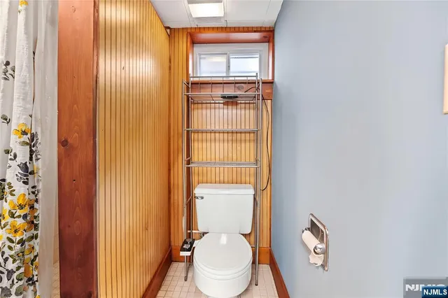 a view of a street with wooden fence