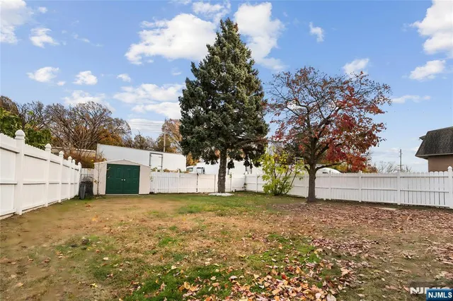a view of a outdoor space with a house in the background