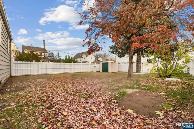 a view of a yard with a tree